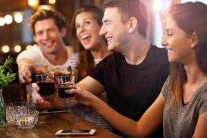 Group Of Friends Enjoying Meal In Restaurant